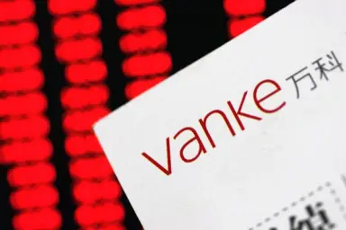 Evergrande приобретает долю в испытывающей трудности Vanke